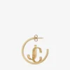 Aros Jc Monogram de metal con acabado dorado Aros Jc Monogram Aros Jc Monogram de metal con acabado dorado Aros Jc Monogram