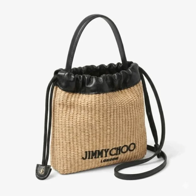 Bolsa con cordón y asa superior Bolsa con cordón de rafia suave natural y negra con ribetes de cuero Bolsa con cordón y asa superior Bolsa con cordón de rafia suave natural y negra con ribetes de cuero