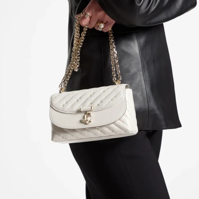 Bolso bandolera pequeño Curve en piel napa acolchada color latte Bolso bandolera pequeño Curve en piel napa acolchada color latte
