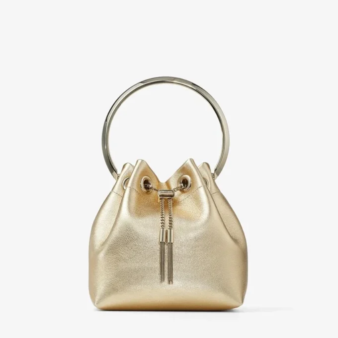Bolso Bon Bon de napa metalizada dorada con asa metálica Bolso Bon Bon de napa metalizada dorada con asa metálica