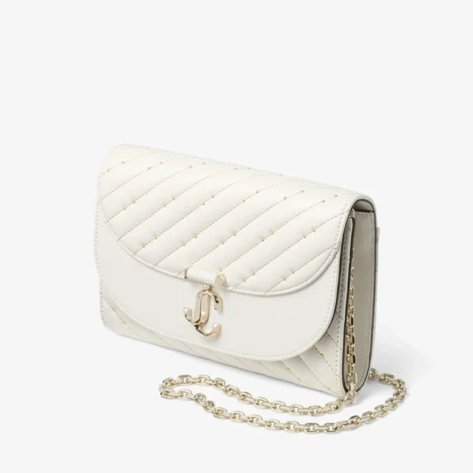 Bolso de mano Avenue Curve Clutch de piel napa acolchada color latte Bolso de mano Avenue Curve Clutch de piel napa acolchada color latte