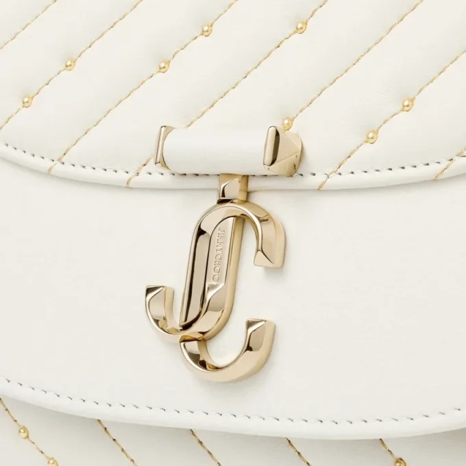 Bolso de mano Avenue Curve Clutch de piel napa acolchada color latte Bolso de mano Avenue Curve Clutch de piel napa acolchada color latte