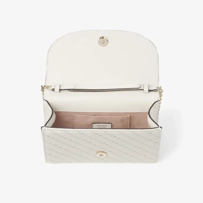 Bolso de mano Avenue Curve Clutch de piel napa acolchada color latte Bolso de mano Avenue Curve Clutch de piel napa acolchada color latte