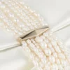 Bolso de mano Zandra de satén marfil Bolso de mano Zandra de satén marfil
