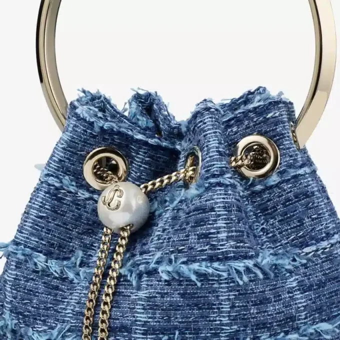 Bolso tipo cubo Bon Bon de tejido vaquero con diseño entrecruzado Bolso tipo cubo Bon Bon de tejido vaquero con diseño entrecruzado
