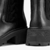 Botines Tamia planos de piel de becerro brillante en negro con tejido de punto trenzado Botines Tamia planos de piel de becerro brillante en negro con tejido de punto trenzado