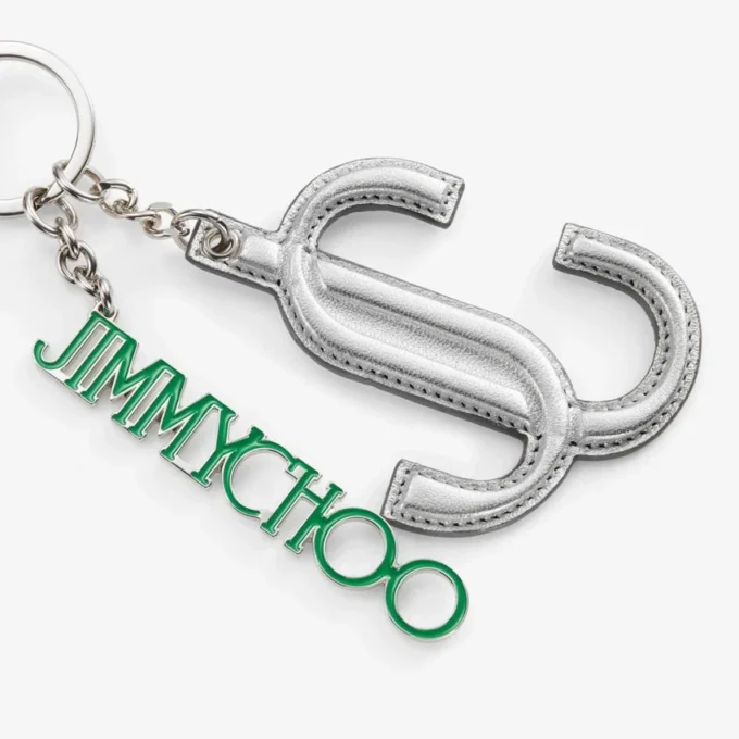 Colgante para bolso Jc Multi Charm en napa metalizada plateada y verde con el logotipo de la estrella
