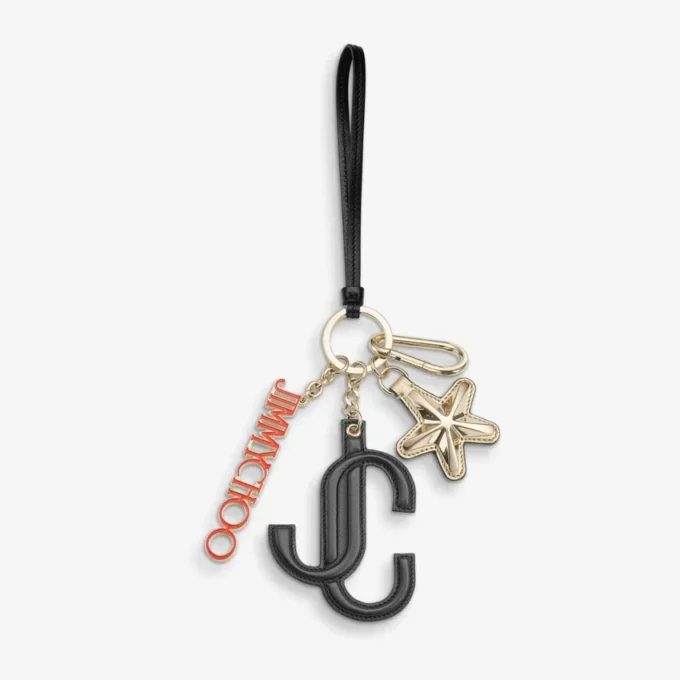 Colgante para bolso Jc Multi Charm en piel de becerro negra y naranja con logotipo de estrella
