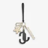 Colgante para bolso Jc Multi Charm en piel de becerro negra y naranja con logotipo de estrella