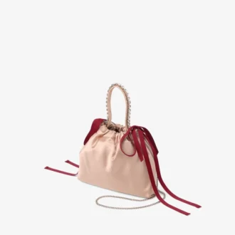 Mini bolso de satén con asas superiores y cordones en colores macaron y rojo rubí Mini bolso de satén con asas superiores y cordones en colores macaron y rojo rubí