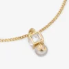 Pulsera Jc Pearl Cube Pulsera de metal dorado con perla y cubo de cristal