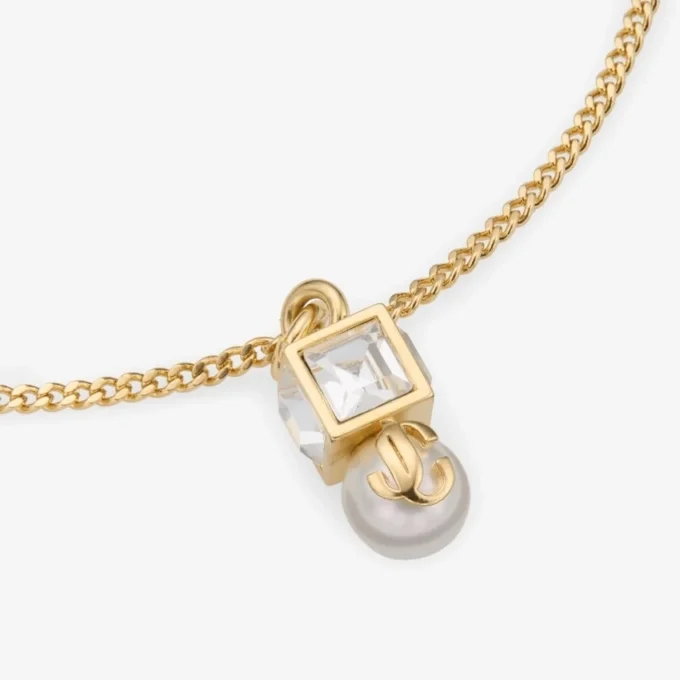 Pulsera Jc Pearl Cube Pulsera de metal dorado con perla y cubo de cristal