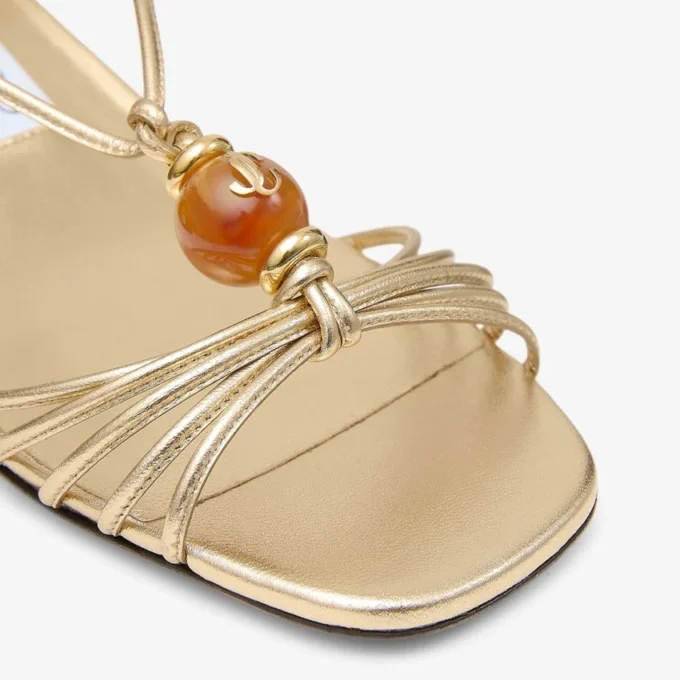 Sandalias Lova 50 de piel napa metalizada dorada con abalorios