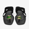 Sandalias planas Emeri Stone en ante negro y verde trébol