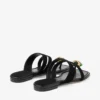 Sandalias planas Emeri Stone en ante negro y verde trébol