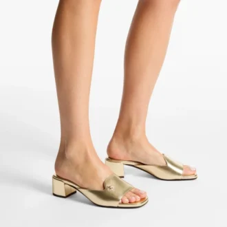 Sandalias tipo mule Dina 45 de piel metalizada dorada
