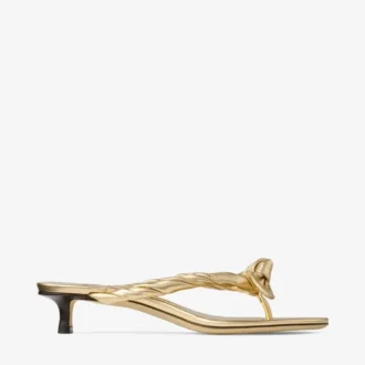 Sandalias tipo mule Liss 35 de piel napa metalizada dorada con lazo